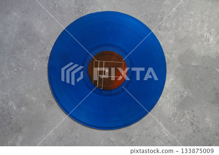 Aged black paper cover and vinyl LP record isolated on black background Aged black paper cover and vinyl LP record isolated on black background 133875009