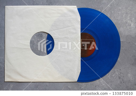 Aged black paper cover and vinyl LP record isolated on black background Aged black paper cover and vinyl LP record isolated on black background 133875010