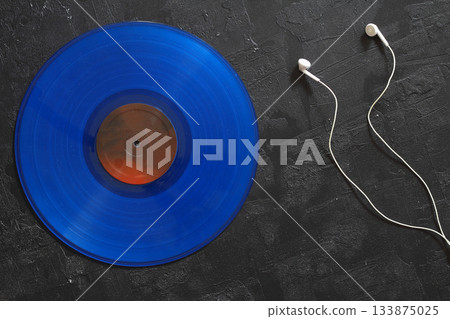Blue Vinyl record on a black background. Retro style. Top view. Blue Vinyl record on a black background. Retro style. Top view. 133875025