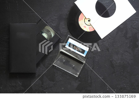 Vinyl record, cd, audio and video cassettes top view 133875169