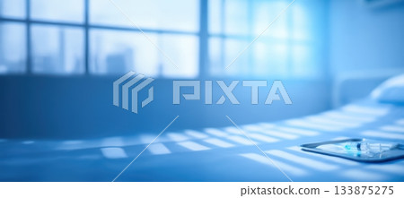 A serene bedroom scene with a smartphone placed on the bed, soft natural light present 133875275