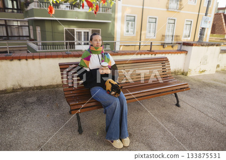 Energetic city dweller with bright adornments posed naturally Energetic city dweller with bright adornments posed naturally 133875531