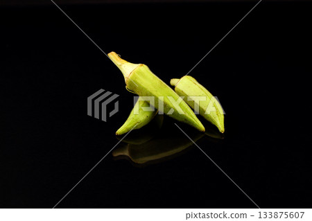Fresh young okra or ladyfinger isolated on black background 133875607
