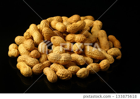 Peanuts in shell on a black background. Top view. Copy, empty space for text 133875618
