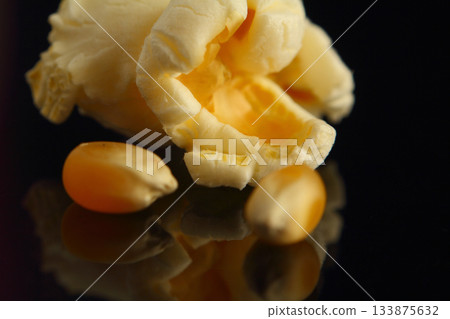 Single popped popcorn on a black background. Close-up or macro with clipping path Single popped popcorn on a black background. Close-up or macro with clipping path 133875632