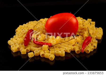 italian pasta with tomato sauce and red hot chili peppers. 133875653