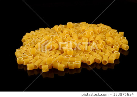 some small pieces of dried pasta as a background some small pieces of dried pasta as a background 133875654