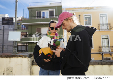 Couple enjoying bright day with musical and fashion elements Couple enjoying bright day with musical and fashion elements 133875662
