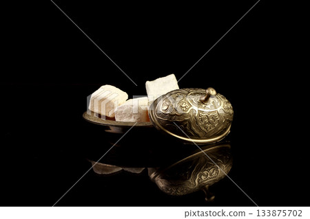 Traditional turkish coffee and turkish delight. Close up. Traditional turkish coffee and turkish delight. Close up. 133875702