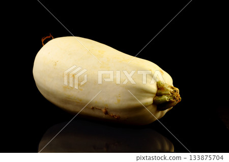 Butternut squash isolated against a black background 133875704