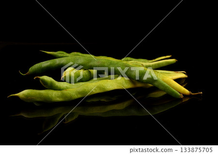 Green string beans on a black background. Healthy organic food collection. Copy Space for Text. Green string beans on a black background. Healthy organic food collection. Copy Space for Text. 133875705