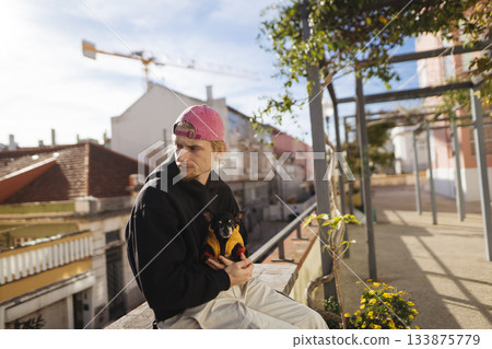 Musician finds serenity among city streets and bright rays Musician finds serenity among city streets and bright rays 133875779