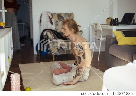 Intimate moment showing affection between man and dog in cozy living space Intimate moment showing affection between man and dog in cozy living space 133875886