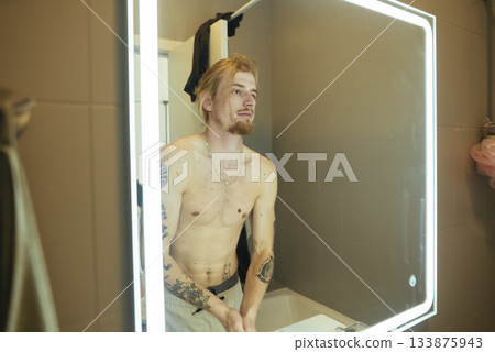 Personal grooming routine captured in stylish bathroom environment 133875943