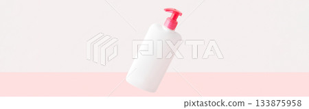 Bottle of intimate hygiene gel on pastel pink and white background. Body care concept 133875958