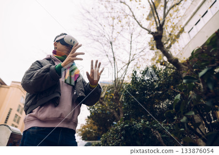 Street singer expressing emotions amid urban courtyard surroundings Street singer expressing emotions amid urban courtyard surroundings 133876054