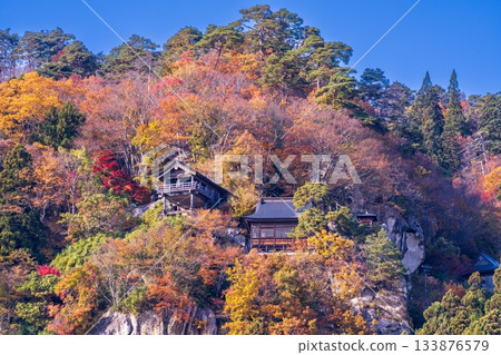 Autumn mountain temple surrounded by autumn leaves Autumn mountain temple surrounded by autumn leaves 133876579