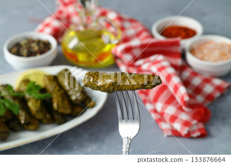 Stuffed collard greens with boiled leaves, traditonal turkish black sea region food, sarma, dolma Stuffed collard greens with boiled leaves, traditonal turkish black sea region food, sarma, dolma 133876664
