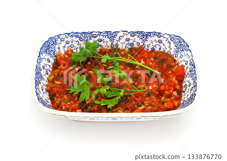 A spicy Turkish appetizer "Acili ezme" made with tomatoes, pepper, parsley, mint, olive oil A spicy Turkish appetizer "Acili ezme" made with tomatoes, pepper, parsley, mint, olive oil 133876770