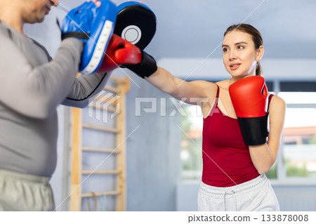 Woman training in gym Woman training in gym 133878008