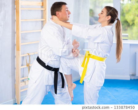 Woman and man in kimono exercising Woman and man in kimono exercising 133878450