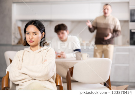 Adult and young man quarreling with woman Adult and young man quarreling with woman 133878454