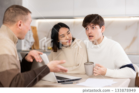 Experienced male agent offers to issue an insurance policy or take out financial loan for spouses at home Experienced male agent offers to issue an insurance policy or take out financial loan for spouses at home 133878949