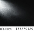 Background material with light shining into a black background 133879189