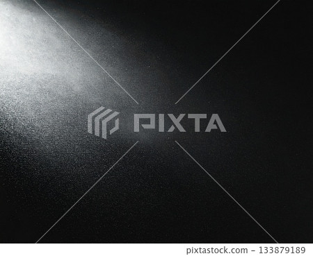 Background material with light shining into a black background Background material with light shining into a black background 133879189