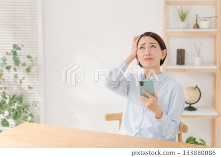 Woman with a surprised expression Woman with a surprised expression 133880086