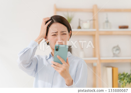 Woman with a surprised expression Woman with a surprised expression 133880087