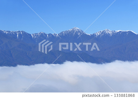 Northern Alps in early winter floating in a sea of clouds 133881868