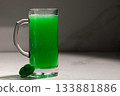 Festive Green Beer With Clover, Lush Green Stout In Mug With Bubbles And Small Clover 133881886