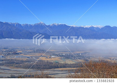 Azumino in the morning mist and the Northern Alps in early winter Azumino in the morning mist and the Northern Alps in early winter 133881928