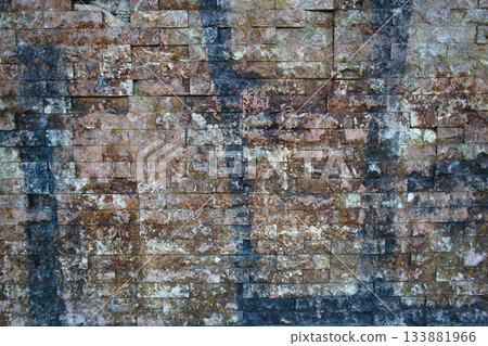 Detailed view of aged brick wall with dark stains 133881966