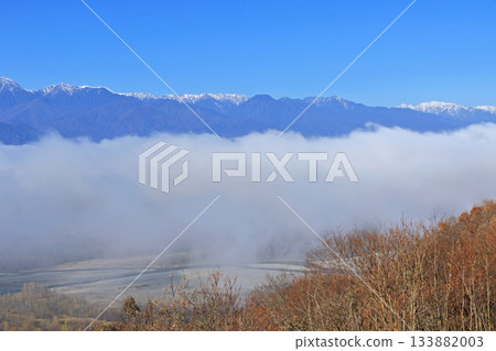 Northern Alps in early winter floating in a sea of clouds 133882003