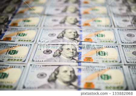 Blurred composition of US $100 bills arranged at an angle Blurred composition of US $100 bills arranged at an angle 133882068