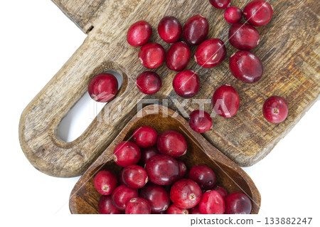Fresh Red Cranberries On Rustic Wooden Cutting Board With Scoop Fresh Red Cranberries On Rustic Wooden Cutting Board With Scoop 133882247