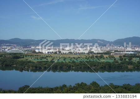 Takatsuki cityscape seen across the Yodo River from a high-rise apartment building in Hirakata 133883194