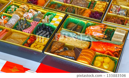A tiered box of osechi dishes and a luxurious New Year's assortment 133883506
