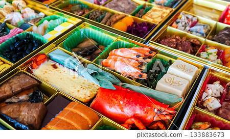 A tiered box of osechi dishes and a luxurious New Year's assortment A tiered box of osechi dishes and a luxurious New Year's assortment 133883673