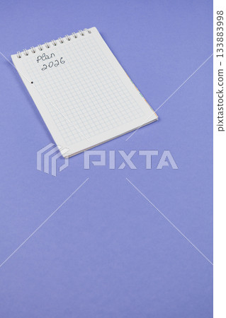 Planning for the future with a blank notepad on a purple background 133883998