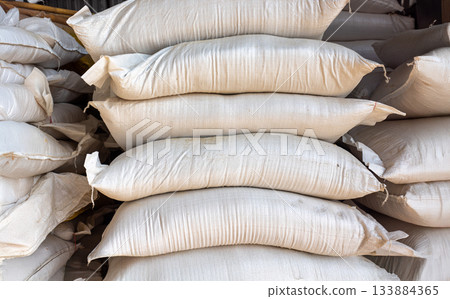 Animal feed ingredients bags stacking in farm. Animal feed ingredients bags stacking in farm. 133884365