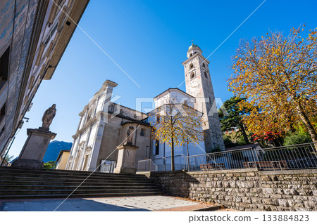 Tower of the Cathedral of San Lorenzo and city view. Lugano, Ticino, Switzerland Tower of the Cathedral of San Lorenzo and city view. Lugano, Ticino, Switzerland 133884823