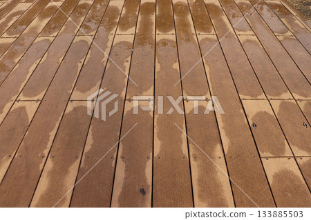 Wet wooden terrace after the rain Wet wooden terrace after the rain 133885503