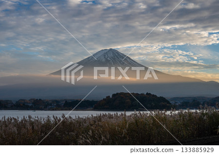 Fuji at dusk, orange clouds passing by Fuji at dusk, orange clouds passing by 133885929