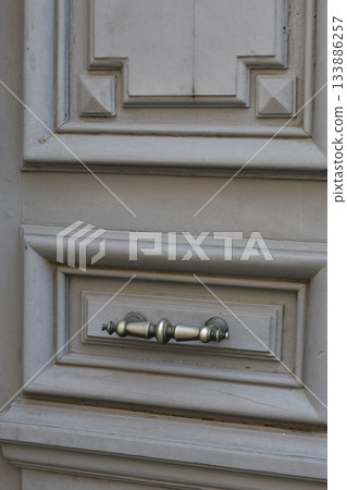 Vintage wooden door element. Vertical white retro door. 133886257