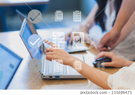 Women exchanging opinions while using a computer at a meeting Women exchanging opinions while using a computer at a meeting 133886473