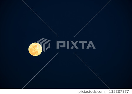 Bright full moon in the night sky Bright full moon in the night sky 133887577