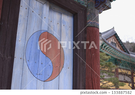 Detail of the Taegeuk Pattern and Traditional Dancheong on a Korean Temple Door Detail of the Taegeuk Pattern and Traditional Dancheong on a Korean Temple Door 133887582